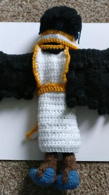 Back view, showing the tunic, scart, collar and wings