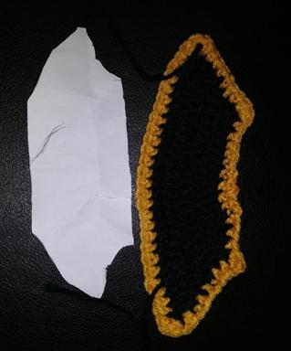 The collar with the paper template used to make it