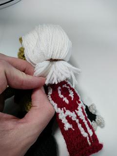 Back view, showing the cut hair and the cape