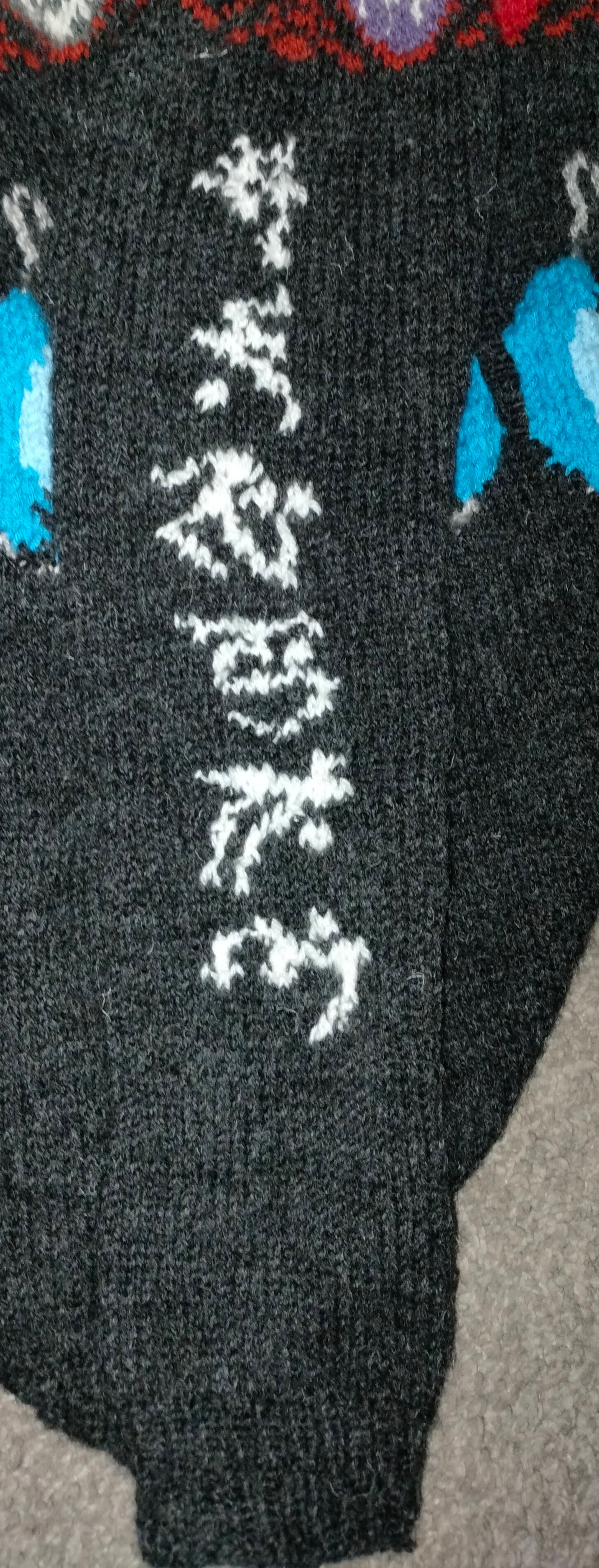 The right sleeve, lying flat on the floor