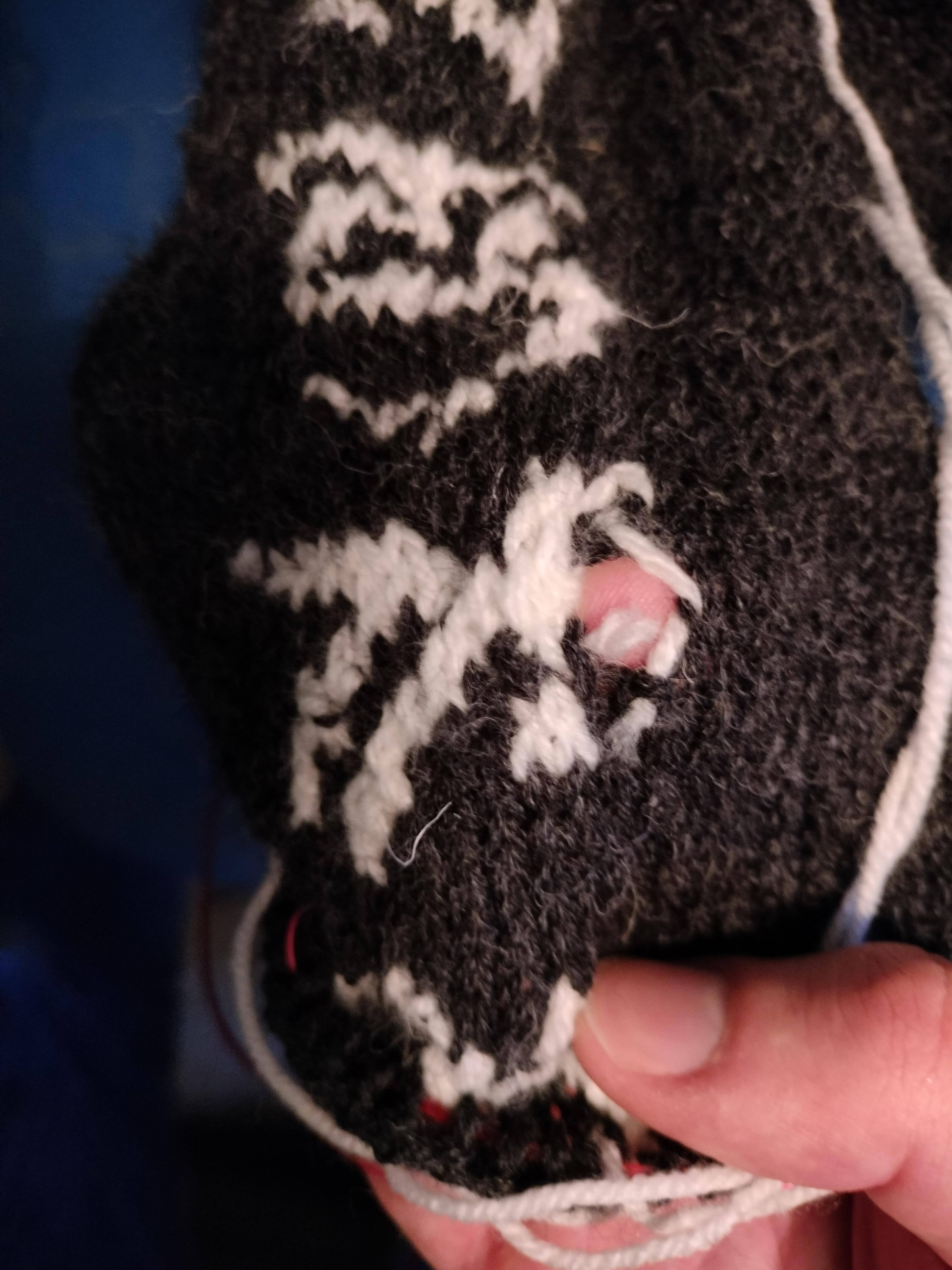 Zephon's symbol, with my finger poking through the hole